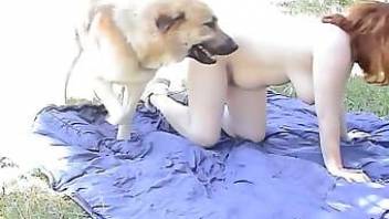 Redhead lady and dog love filthy sex