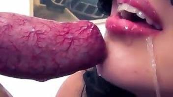 Cute-looking brunette is sucking dog cock